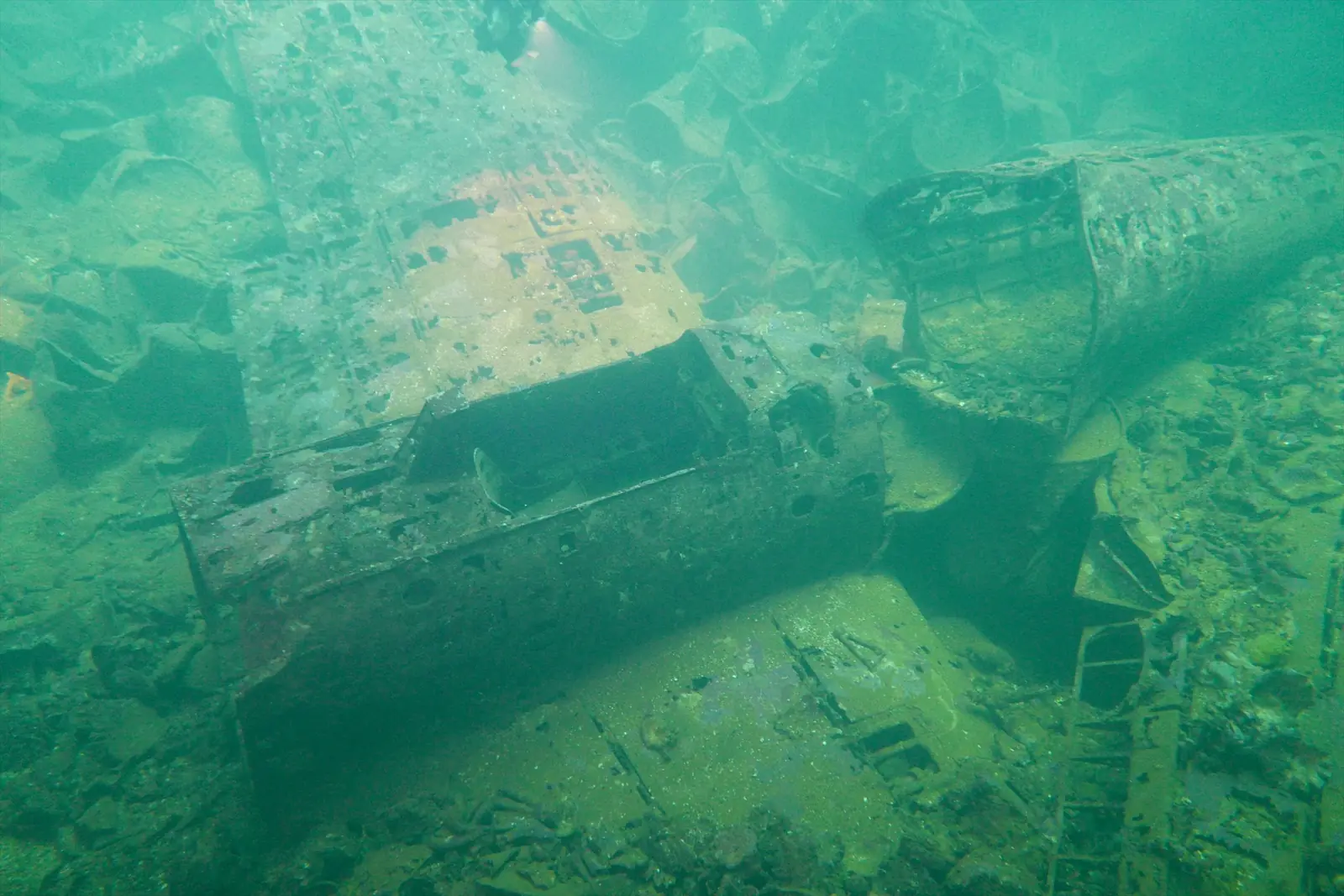 A Zero fighter aircraft inside the hold of the Fujikawa Maru